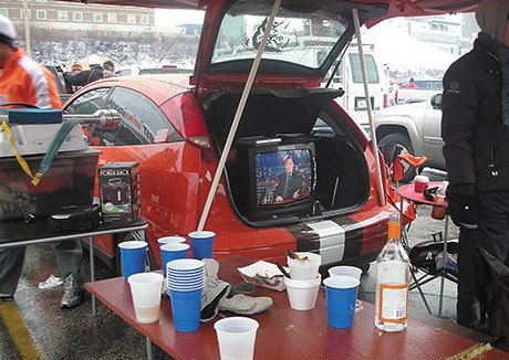 Folding table under a canopy with the hatchback open